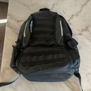 Nike- color: black, backpack, insulated pocket. Laptop holder, shoe holder.